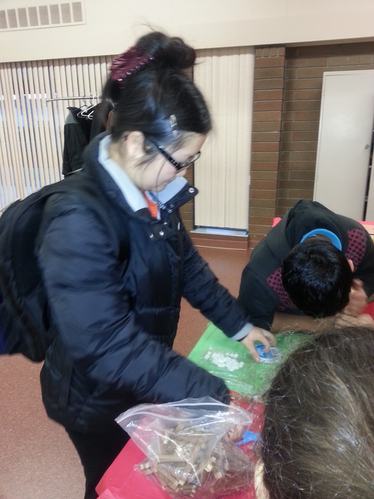 Laura making Christmas ornaments with the kids